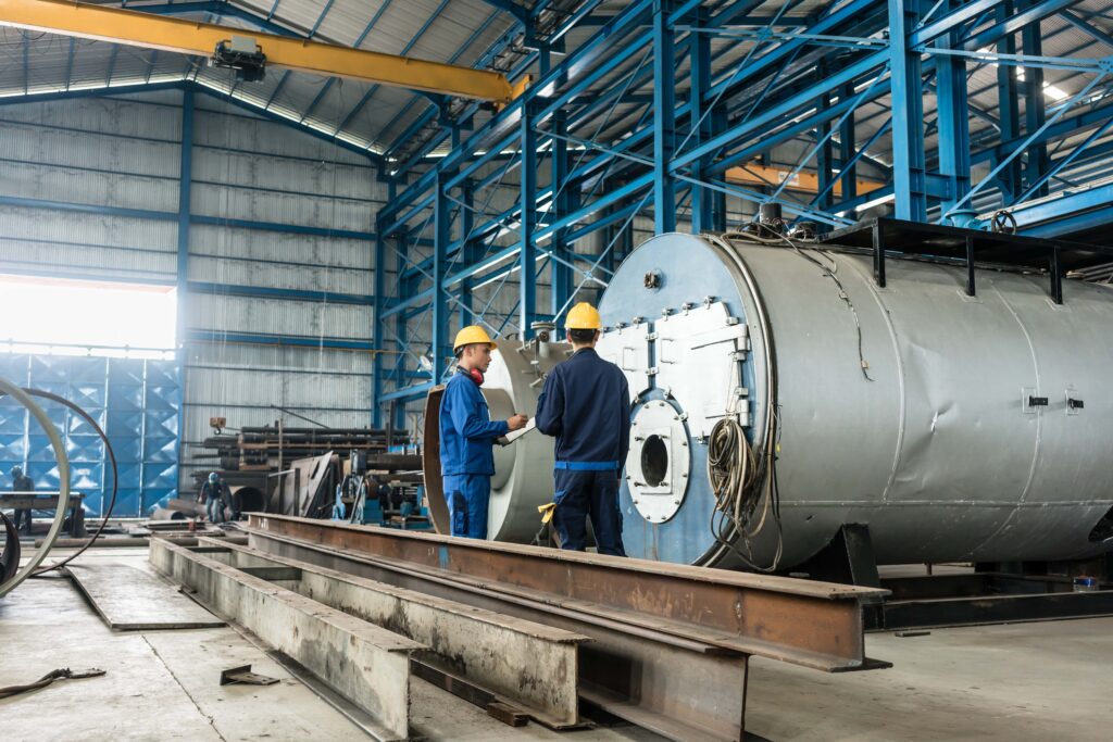 Two workers in a manufacturing warehouse.