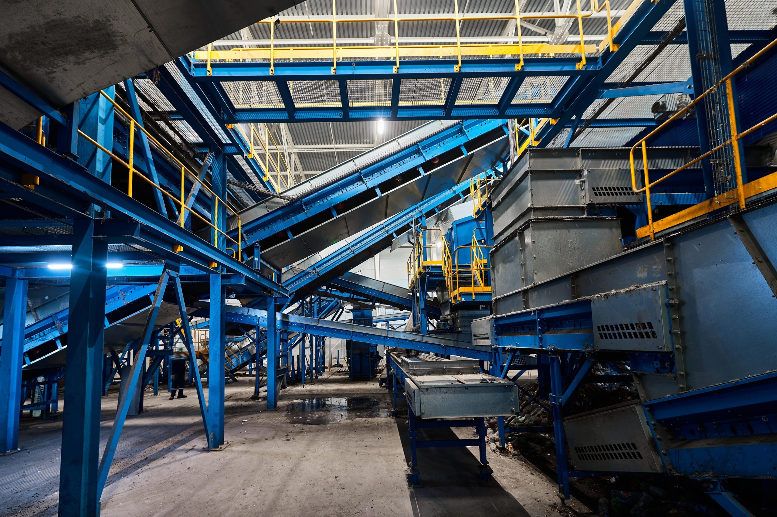 Multiple conveyor belts in a warehouse.